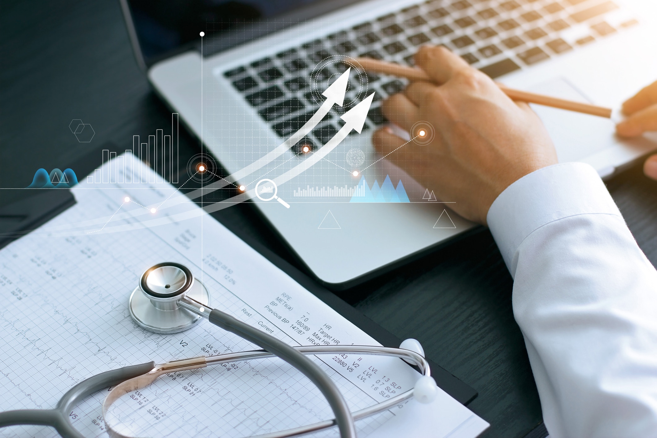 Healthcare business graph and Medical examination and businessman analyzing data and growth chart on laptop background