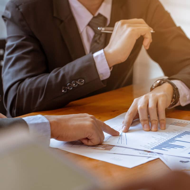 Businessman receive counseling from colleague, It is a picture of the working atmosphere of company employees in the office in the early 21st century.