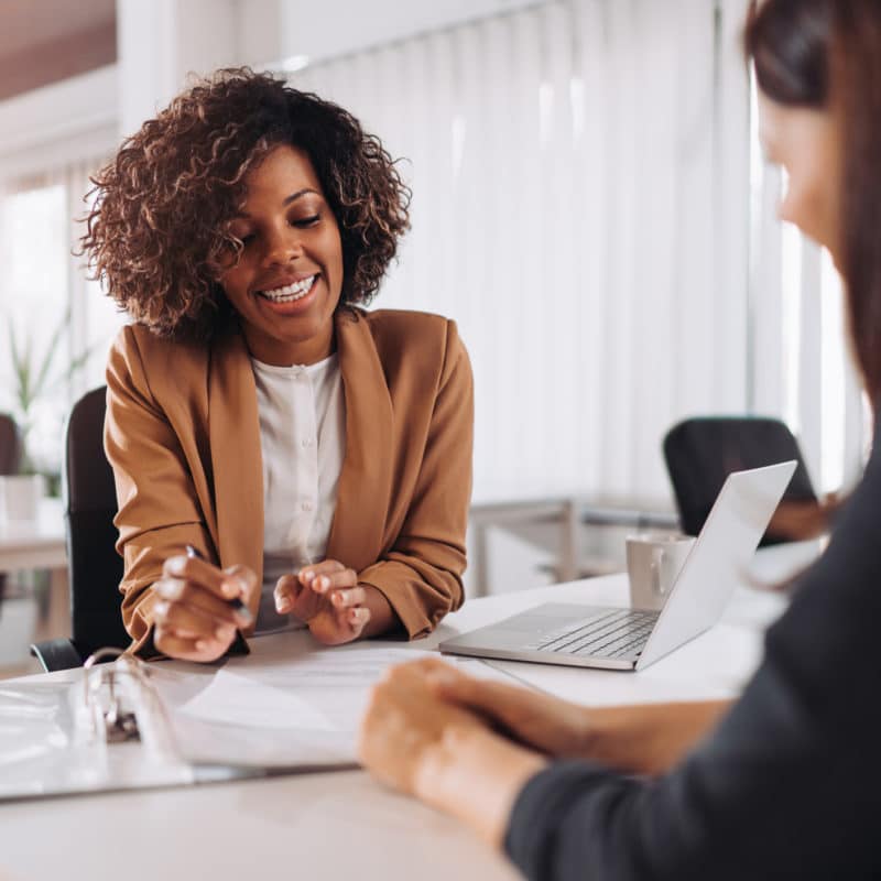 Female client consulting with a agent in the office